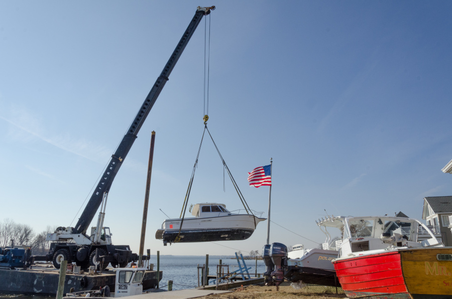 Rumson, NJ, 11./26/12 -- This boat was dropped in a back yard during Hurricane Sandy by the storm surge. Contractors are hired by insurance companies to remove the boats at a cost of about $250 per foot. This boat will cost about $9000 to remove. Photo by Liz Roll/FEMA