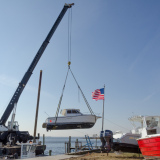 Rumson, NJ, 11./26/12 -- This boat was dropped in a back yard during Hurricane Sandy by the storm surge. Contractors are hired by insurance companies to remove the boats at a cost of about $250 per foot. This boat will cost about $9000 to remove. Photo by Liz Roll/FEMA
